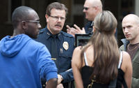 Assistant Police Chief Boyd Long confers with Kali Katt of OSD.