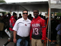 Coach Tom Karlow and starting Quarterback Ernest Wars of Mt Miguel Matadors at East County Food Distribution