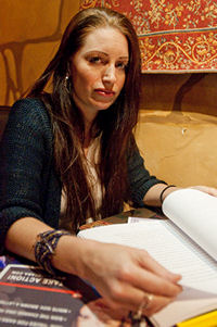 Carrie Christie thumbs through the pages of Sara Kruzan's Petition for Writ of Habeus Corpus (photo: Ron Logan)