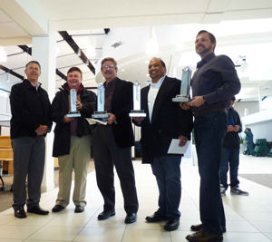 Jim Davies from Gafcon presents gifts to his construction team.